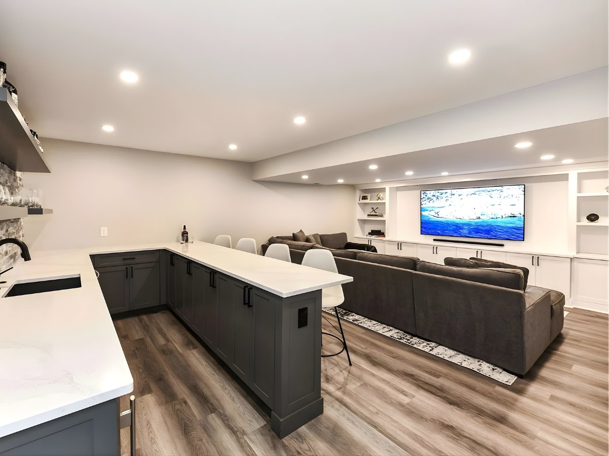 Finished basement family room with wet bar and media wall