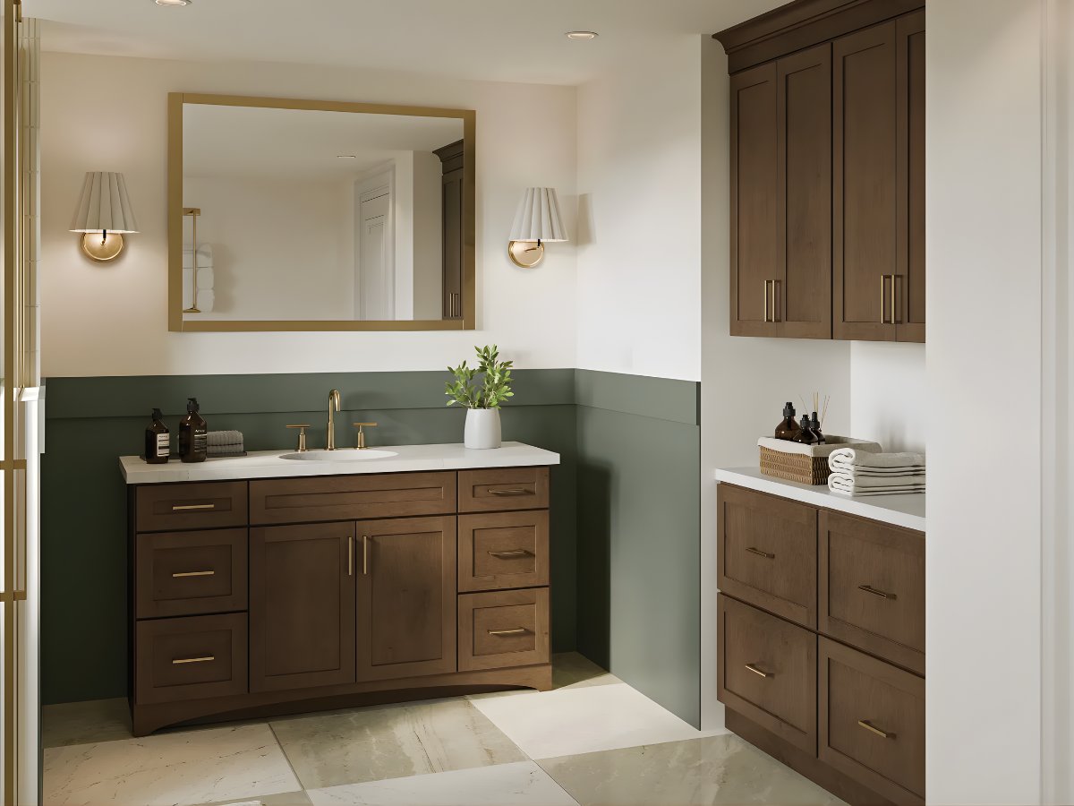 Brown bathroom vanity with green accent wall — Advanced Cabinetry Inc.