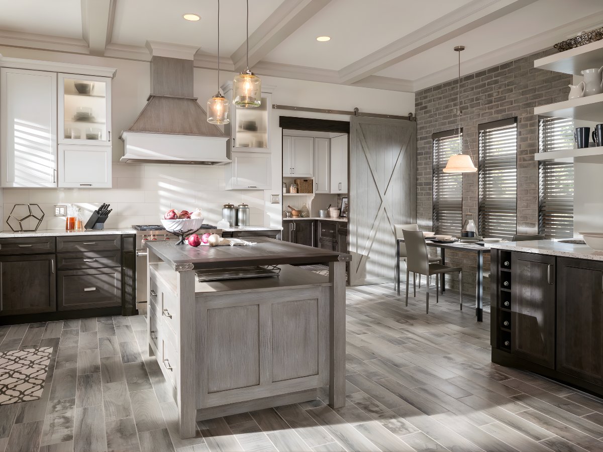 Two-tone kitchen with barn door — Advanced Cabinetry Inc.