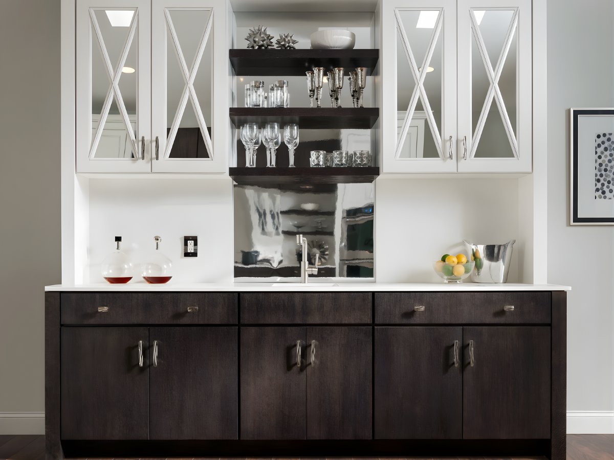 Two-tone wet bar with glass front cabinets and open shelving — Advanced Cabinetry Inc.