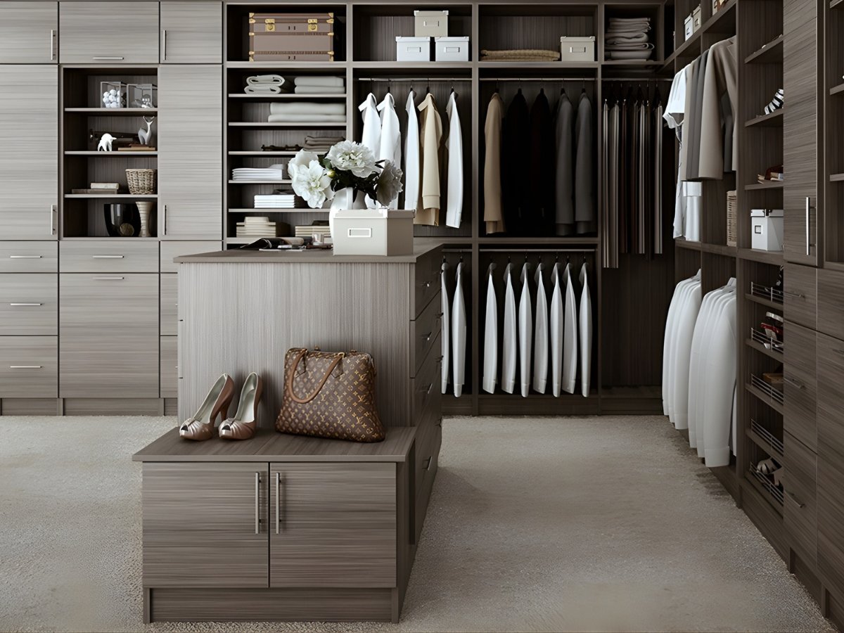 Custom walk-in closet with island and full hanging storage — Advanced Cabinetry Inc.